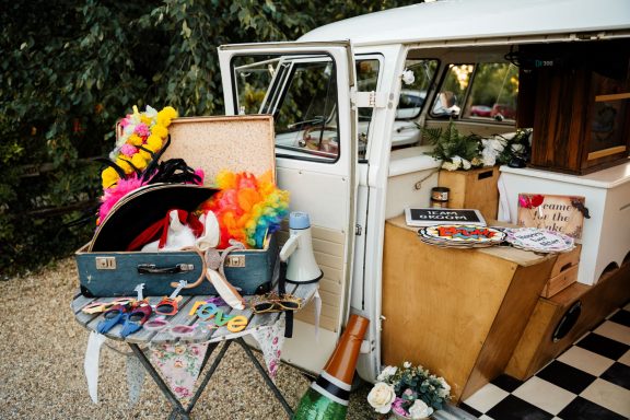 A vintage van displaying an eclectic array of colourful props and items.